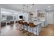 Open kitchen with island seating and a view into the living area at 22085 E Rosa Rd, Queen Creek, AZ 85142