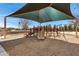 Community playground with shaded play area at 22085 E Rosa Rd, Queen Creek, AZ 85142