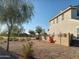 Two story house with a landscaped backyard and block wall at 23472 S 210Th St, Queen Creek, AZ 85142