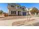 Two-story house with a gray exterior, blue garage door, and landscaping at 23472 S 210Th St, Queen Creek, AZ 85142