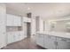 Modern kitchen with white shaker cabinets and a large kitchen island at 23472 S 210Th St, Queen Creek, AZ 85142