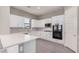 Modern kitchen featuring white cabinets, quartz countertops, and stainless steel appliances at 23472 S 210Th St, Queen Creek, AZ 85142