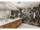 Elegant bathroom with double sinks, a large walk-in shower, and modern fixtures at 23618 W Adams St, Buckeye, AZ 85396