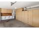 Garage with built-in storage cabinets and workbench at 23618 W Adams St, Buckeye, AZ 85396