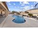 Inviting kidney-shaped pool with waterfall feature in sunny backyard at 23618 W Adams St, Buckeye, AZ 85396