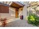 Front entry with terracotta accents and a wooden door at 26247 N El Prado --, Rio Verde, AZ 85263