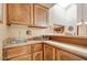 Wet bar with a sink and wood cabinets at 26247 N El Prado --, Rio Verde, AZ 85263