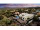 Aerial view of a beautiful home, showcasing its private pool and mountain views at 27931 N Montana Dr, Rio Verde, AZ 85263