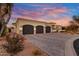 Elegant home exterior with three-car garage and attractive landscaping at 27931 N Montana Dr, Rio Verde, AZ 85263