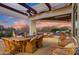 Spacious patio with dining area and breathtaking sunset mountain views at 27931 N Montana Dr, Rio Verde, AZ 85263