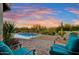 Relaxing patio with turquoise chairs overlooking a refreshing pool at 27931 N Montana Dr, Rio Verde, AZ 85263