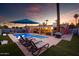 Stunning backyard with a pool, lounge chairs, and outdoor seating area at 2923 N 81St Pl, Scottsdale, AZ 85251