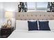 Bedroom with tufted headboard and navy blue pillows at 2923 N 81St Pl, Scottsdale, AZ 85251