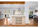 Elegant dining area with a rustic wooden table and modern chandelier at 2923 N 81St Pl, Scottsdale, AZ 85251