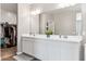 Elegant bathroom with double vanity and large mirror at 29681 W Columbus Ave, Buckeye, AZ 85396