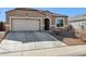 Single story home with a two-car garage and drought-tolerant landscaping at 29681 W Columbus Ave, Buckeye, AZ 85396