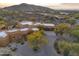 Aerial view of house, showcasing a large yard and desert landscape at 30600 N Pima Rd # 63, Scottsdale, AZ 85266