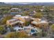 Aerial view of house, pool, and surrounding desert landscape at 30600 N Pima Rd # 63, Scottsdale, AZ 85266