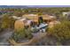 Aerial view showcasing the house's unique design and desert setting at 30600 N Pima Rd # 63, Scottsdale, AZ 85266