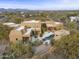 Aerial view of the house highlighting its architecture and desert location at 30600 N Pima Rd # 63, Scottsdale, AZ 85266