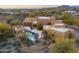 Aerial view of house with pool and desert landscaping at 30600 N Pima Rd # 63, Scottsdale, AZ 85266