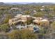 Aerial view of house with pool and expansive desert views at 30600 N Pima Rd # 63, Scottsdale, AZ 85266