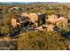 Aerial view of a luxurious desert home with a pool and expansive grounds at 30600 N Pima Rd # 63, Scottsdale, AZ 85266