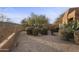 Landscaped backyard with desert plants and gravel at 30600 N Pima Rd # 63, Scottsdale, AZ 85266