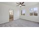 Bright bedroom with ceiling fan and en-suite bathroom access at 30600 N Pima Rd # 63, Scottsdale, AZ 85266