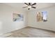 Spacious bedroom with neutral walls and wood-look tile floors at 30600 N Pima Rd # 63, Scottsdale, AZ 85266