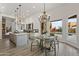 Bright breakfast nook with a charming wooden table and chairs, adjacent to the kitchen at 30600 N Pima Rd # 63, Scottsdale, AZ 85266