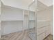 Bright walk-in closet with built-in shelves and drawers at 30600 N Pima Rd # 63, Scottsdale, AZ 85266