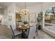 Bright dining room with built-in wet bar and chandelier at 30600 N Pima Rd # 63, Scottsdale, AZ 85266