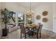 Casual dining area with chandelier and large windows at 30600 N Pima Rd # 63, Scottsdale, AZ 85266