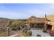 Back exterior view, featuring stucco walls and desert landscaping at 30600 N Pima Rd # 63, Scottsdale, AZ 85266