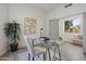 Modern home office with glass desk and large window at 30600 N Pima Rd # 63, Scottsdale, AZ 85266