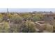 View of the desert landscape and surrounding community from above at 30600 N Pima Rd # 63, Scottsdale, AZ 85266