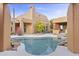 Inviting freeform pool surrounded by desert landscaping at 30600 N Pima Rd # 63, Scottsdale, AZ 85266