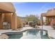 Relaxing pool area with built-in barbecue and mountain views at 30600 N Pima Rd # 63, Scottsdale, AZ 85266