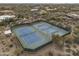 Two tennis courts with surrounding desert views at 30600 N Pima Rd # 63, Scottsdale, AZ 85266