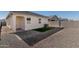 Private backyard with artificial turf and patio at 3210 W Stradling Ave, Apache Junction, AZ 85120