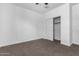 Bright bedroom with carpet flooring and a spacious closet at 3210 W Stradling Ave, Apache Junction, AZ 85120