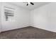 Bright bedroom with carpet flooring and a window at 3210 W Stradling Ave, Apache Junction, AZ 85120