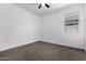 Well-lit bedroom with carpet and a window at 3210 W Stradling Ave, Apache Junction, AZ 85120