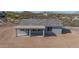 Aerial view showcasing the home's rear, featuring a covered patio at 35810 E 138Th Pl, Scottsdale, AZ 85262