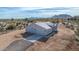 Aerial view of a single-story house with a garage and desert landscape at 35810 E 138Th Pl, Scottsdale, AZ 85262