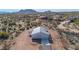 Aerial view of a single-story house with a garage and desert landscape at 35810 E 138Th Pl, Scottsdale, AZ 85262