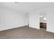 Bright bedroom with wood-look floors and en-suite bathroom at 35810 E 138Th Pl, Scottsdale, AZ 85262