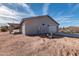 Side view of a house with a garage and desert landscape at 35810 E 138Th Pl, Scottsdale, AZ 85262