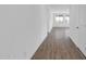 Bright hallway with wood-look tile flooring leading to other rooms at 35810 E 138Th Pl, Scottsdale, AZ 85262